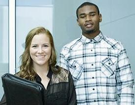 Two students dressed in business attire